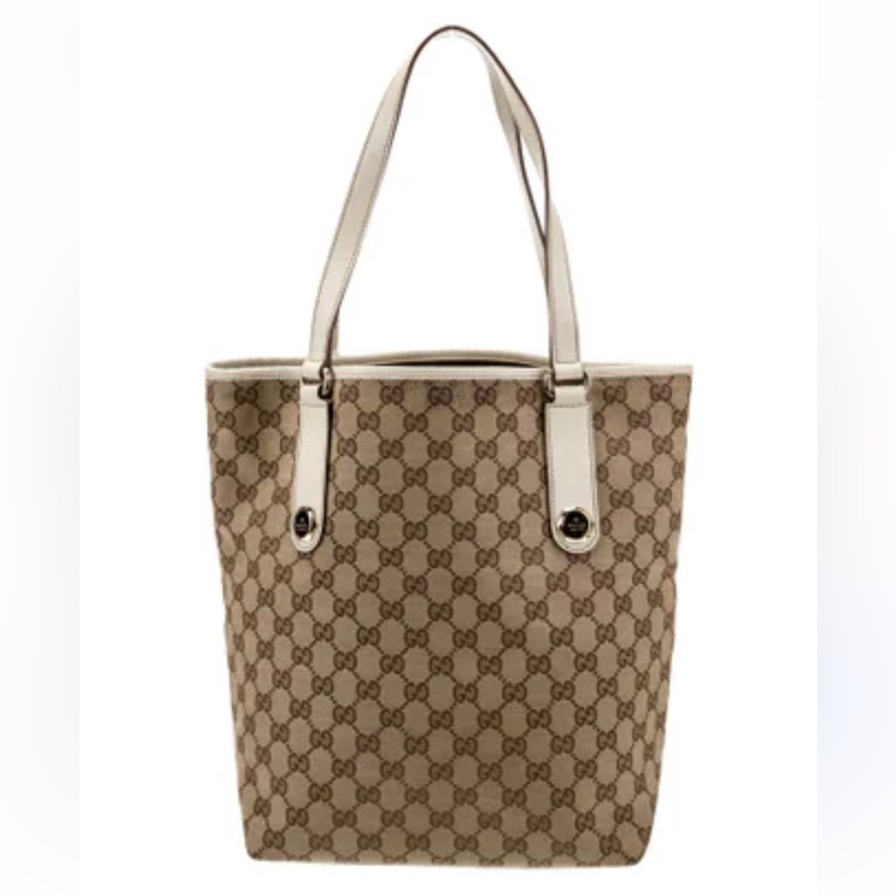 Authentic Gucci Tote. Some wear on canvas and leather trim. Very clean inside.
